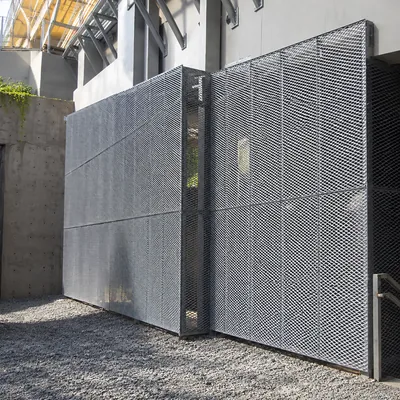Architectural expanded metal facade panels screening exterior building equipment