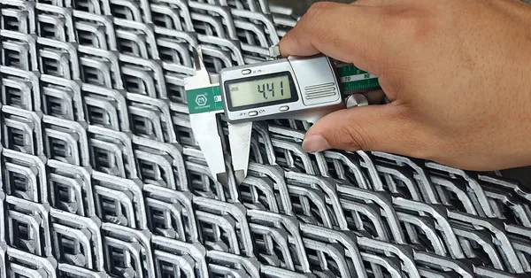 Measuring expanded metal mesh strand width with a digital caliper for weight and open area calculations