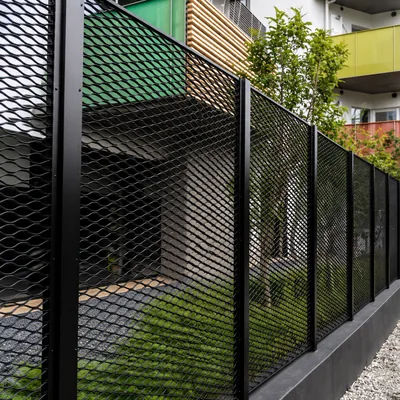 Black expanded metal fencing and security infill panels for a residential building