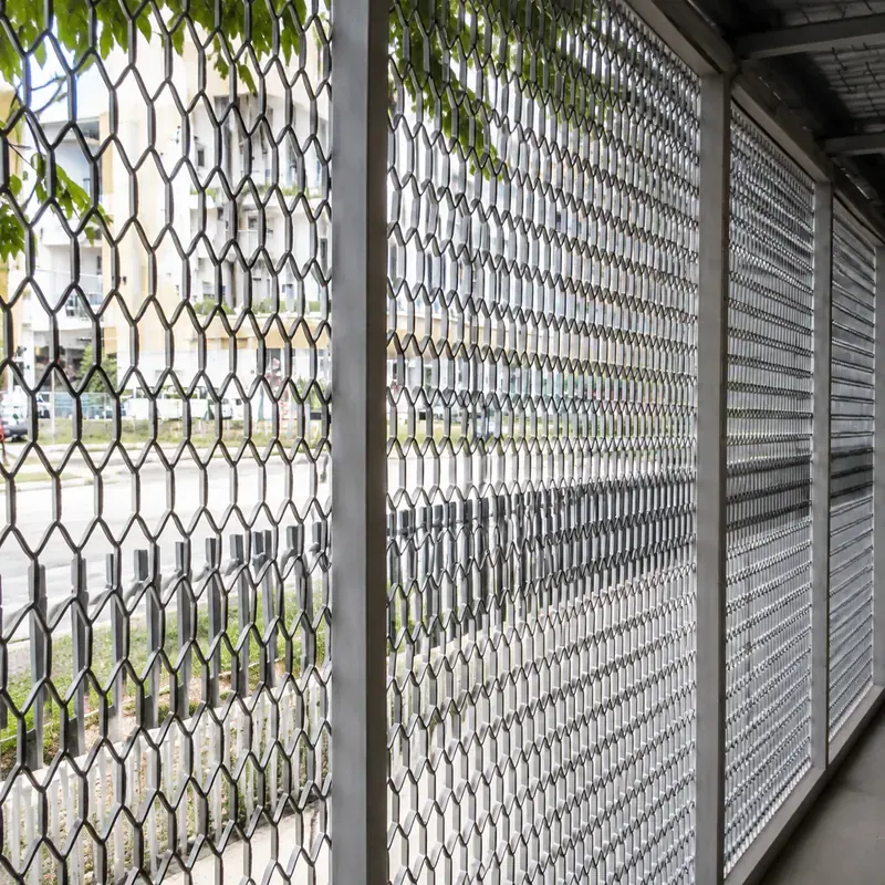 Expanded metal security screen panels installed in steel frames