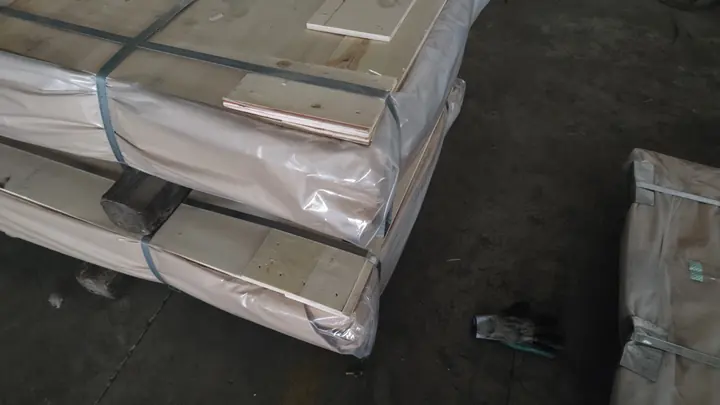 Expanded metal sheet pallets wrapped and strapped for international shipping