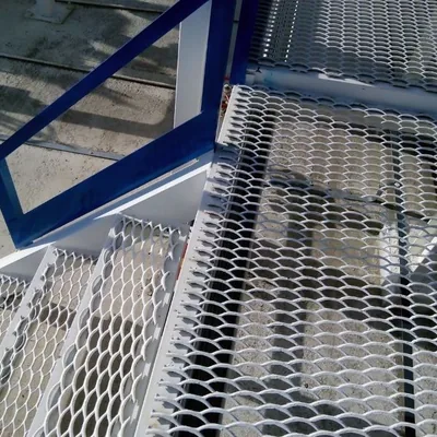 Galvanized expanded metal stair treads on an industrial access staircase