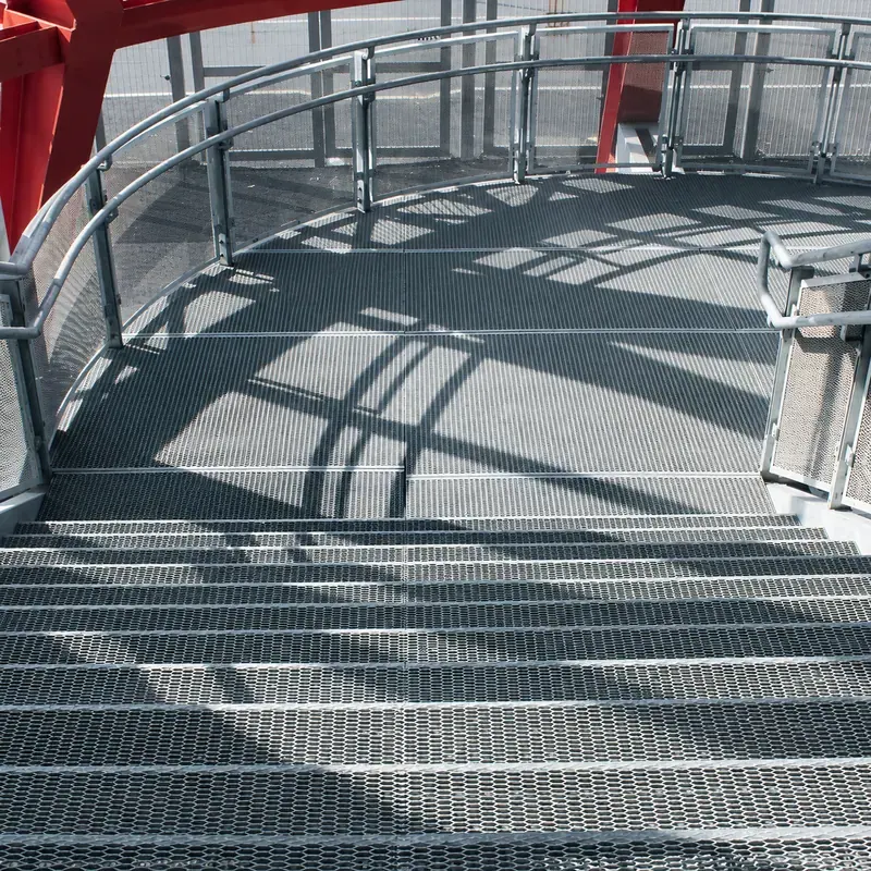 Expanded metal stair treads and circular industrial platform