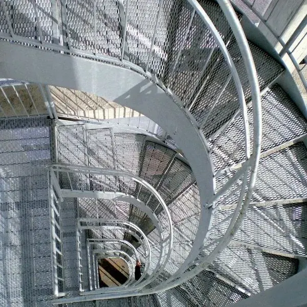 Galvanized expanded metal stair treads on a spiral industrial stair