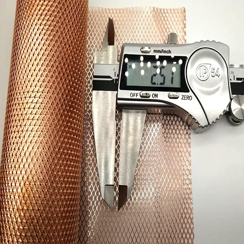 Fine copper expanded metal mesh opening measured with digital caliper