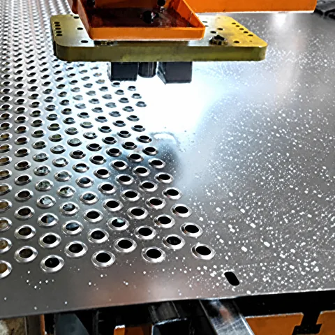 Stainless steel perforated metal sheet surface close-up