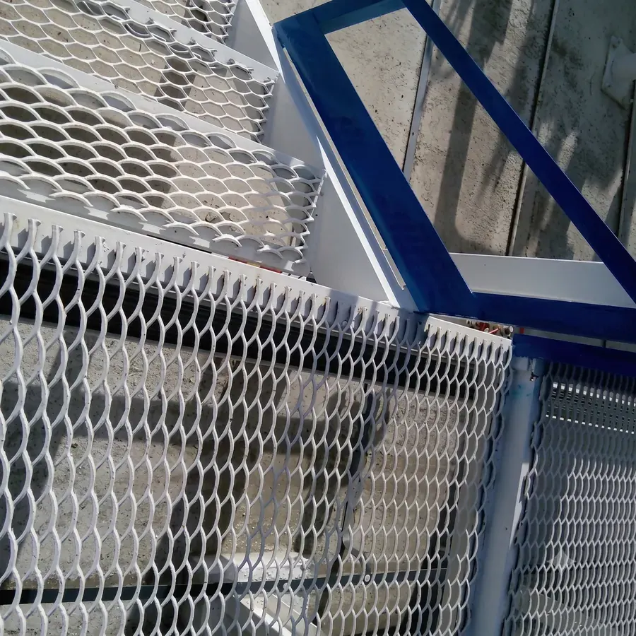 White expanded metal stair tread with raised open mesh detail