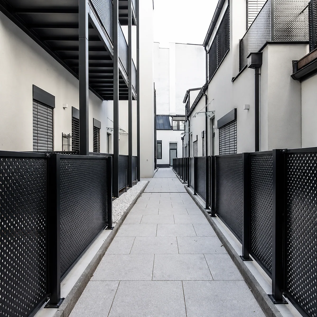 Perforated metal facade panels for residential screening