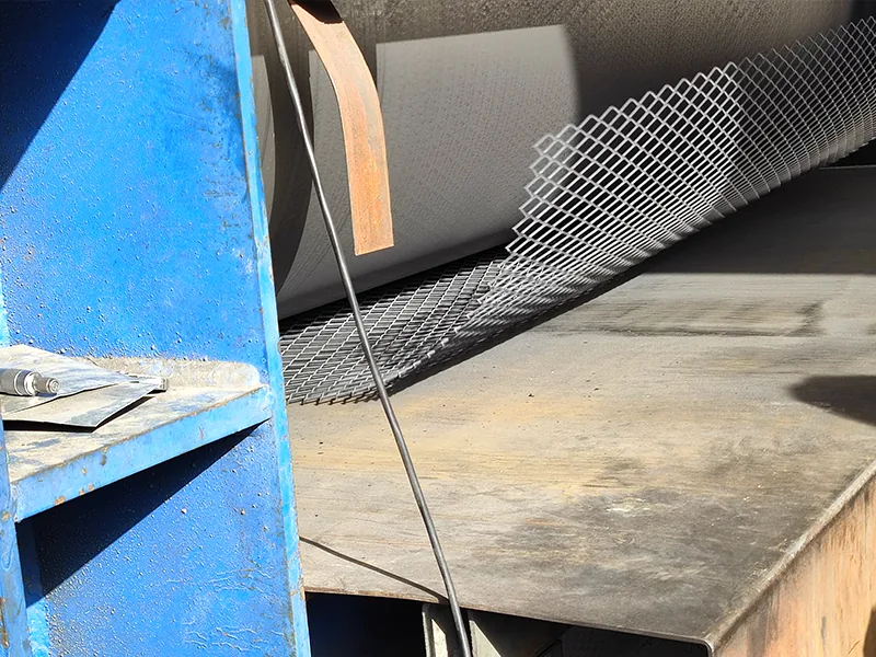Expanded metal forming machine feeding sheet through the production line