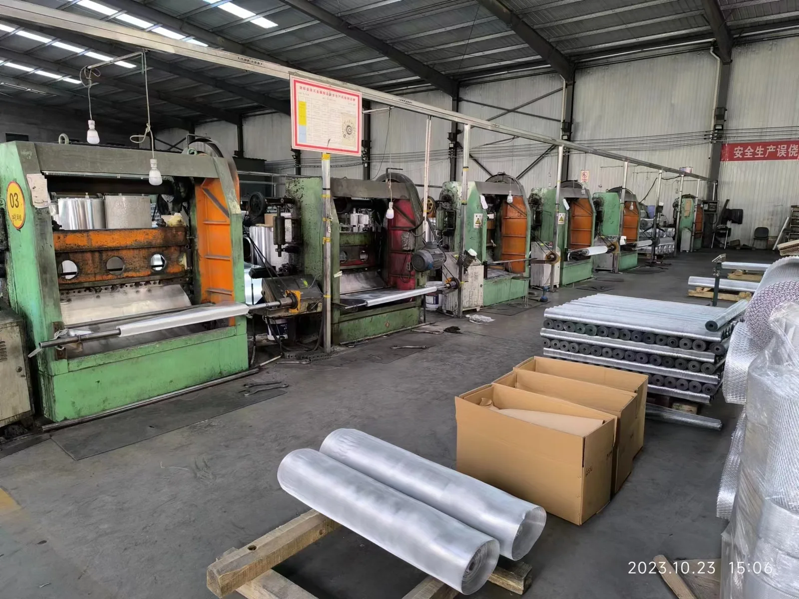 Expanded metal production line with machines, aluminum rolls and packed materials