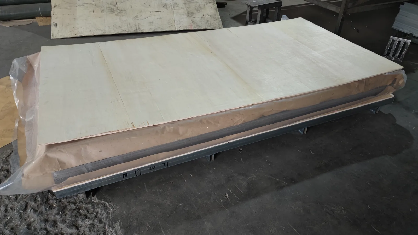 Metal sheet bundles wrapped and secured for transport