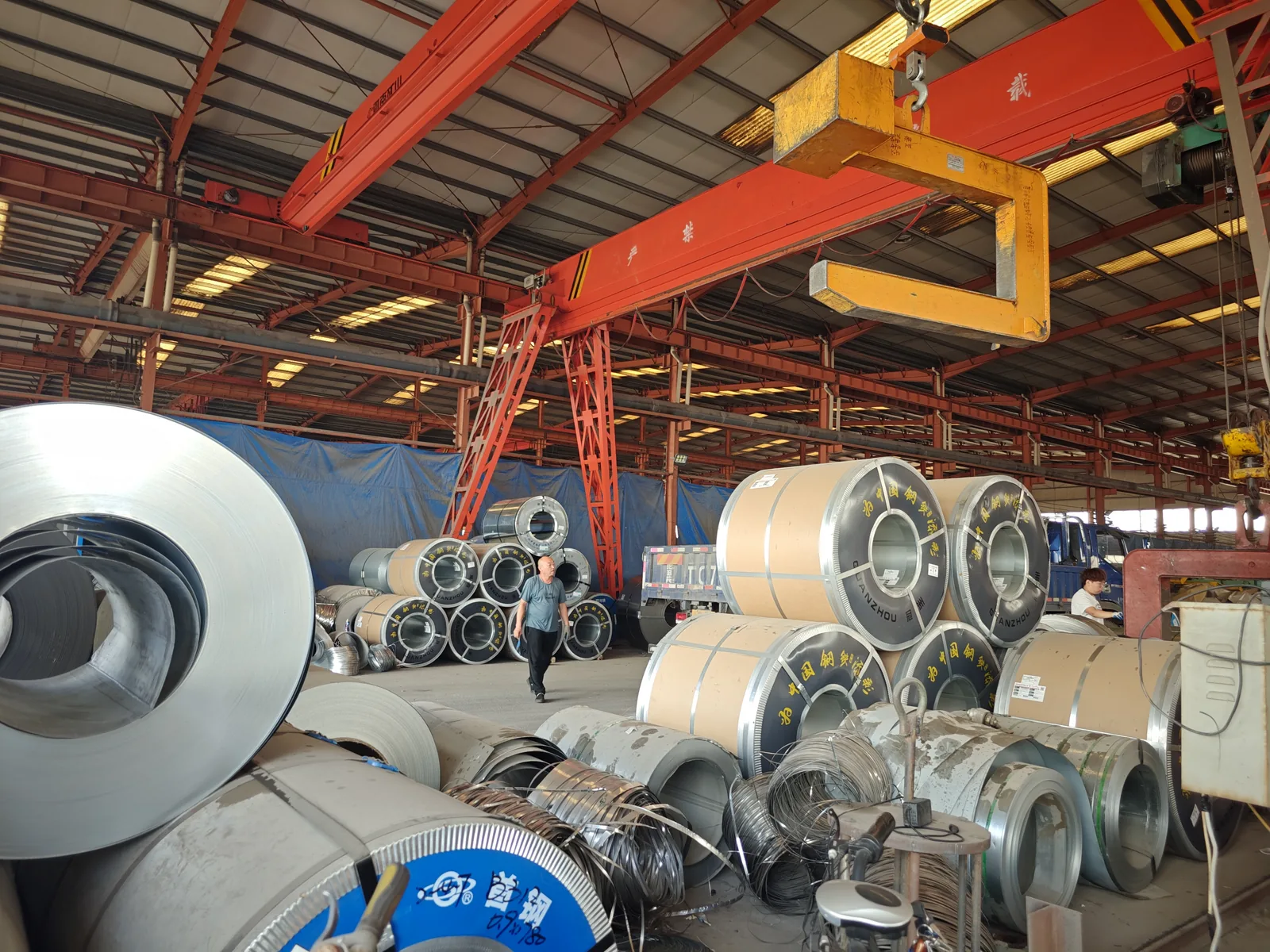 Metal coils and sheet stock stored in the raw material area
