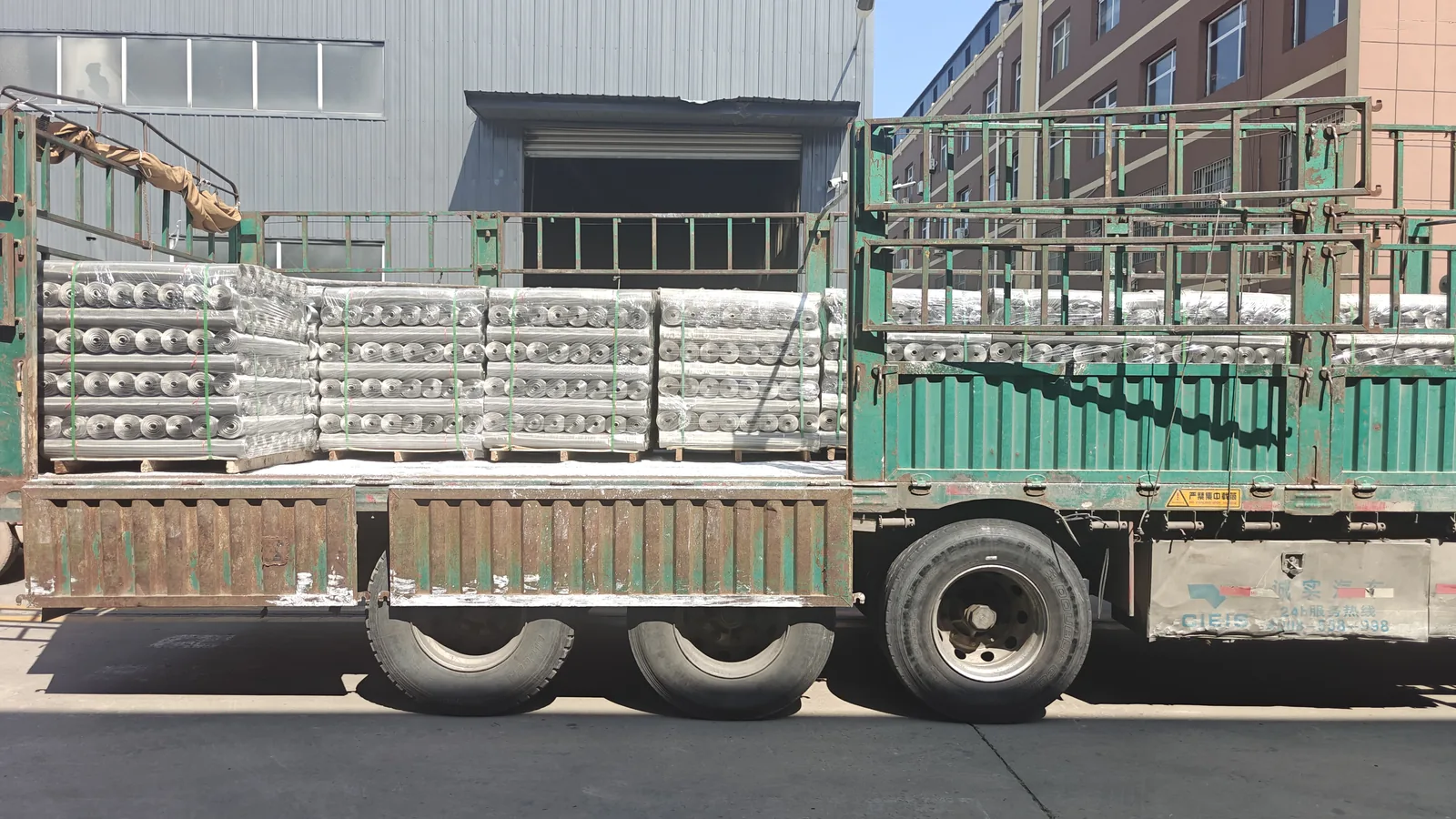 Wrapped expanded metal rolls loaded on a delivery truck