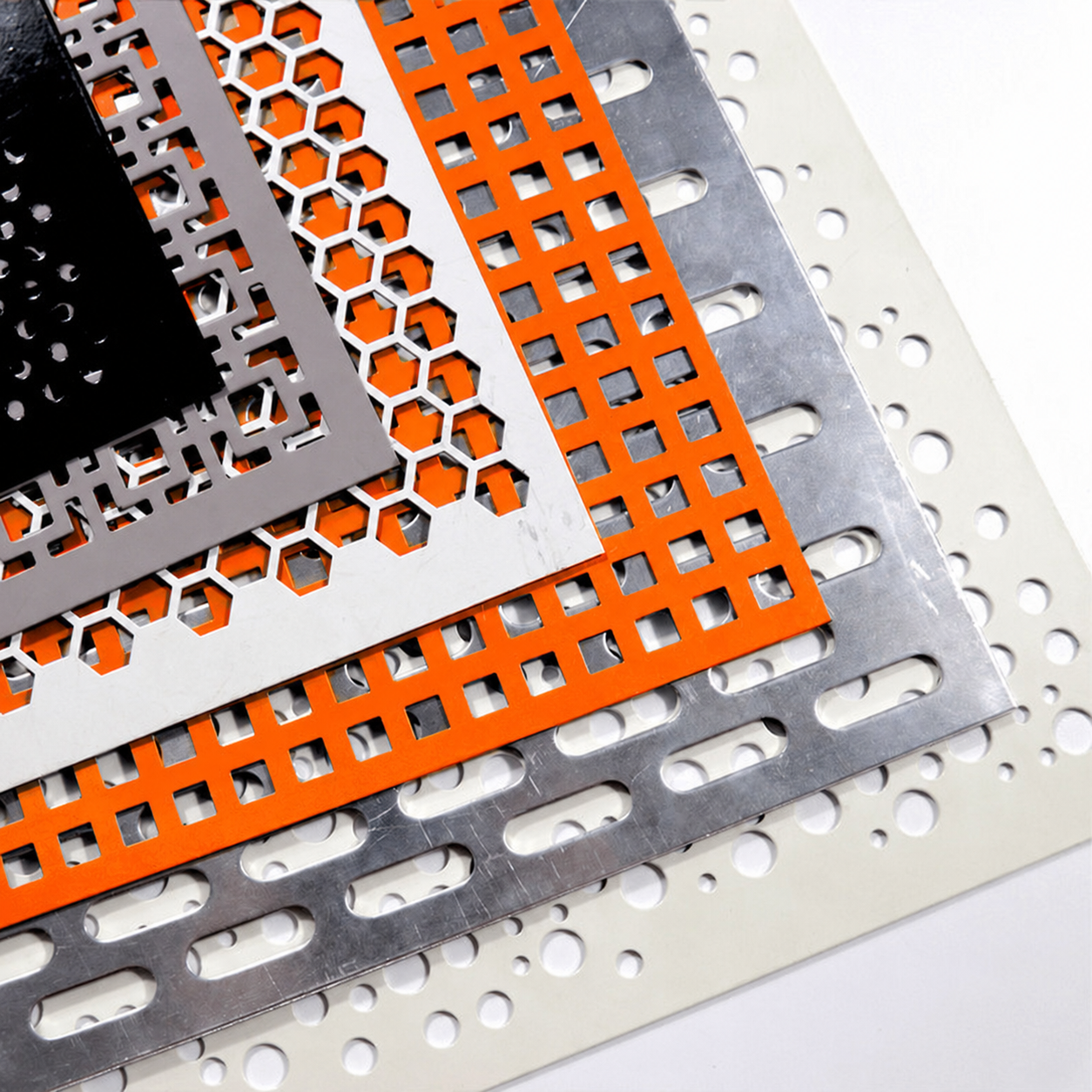 Custom aluminium perforated sheet samples with square, hexagonal, slotted and round hole patterns