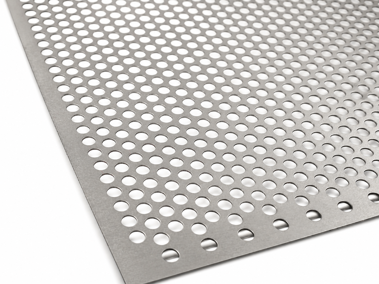 Close-up of titanium perforated sheet with round holes