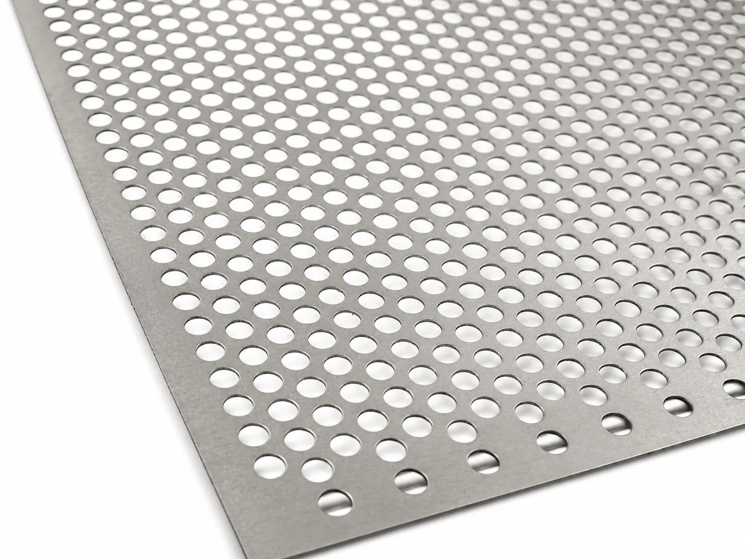 Close-up of titanium perforated sheet with round holes
