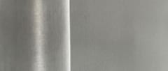 Fine stainless steel filter cloth surface showing its closely woven texture