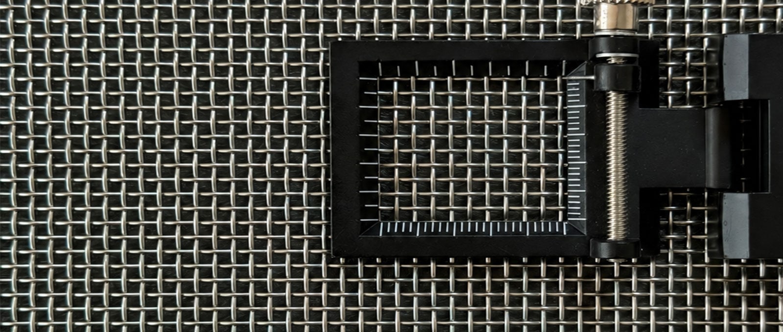 Stainless steel plain weave wire mesh with square openings and a folding inspection magnifier