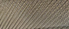 Close-up of stainless steel twill weave wire mesh showing staggered wire intersections