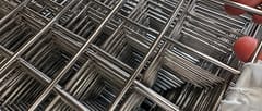 Close-up of stainless steel welded wire mesh intersections with smooth welded joints